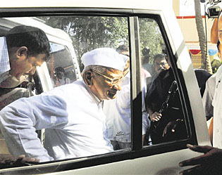 Anna Hazare arrives at his native village Ralegan Siddhi in Ahmednagar on Thursday.  PTI