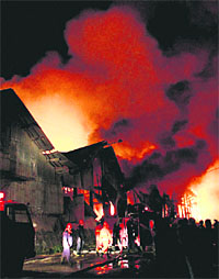 Smoke billows out from a warehouse in Pazundaung township, Myanmar, on Thursday.