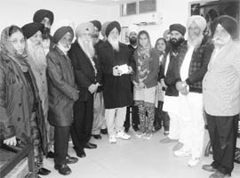 Shiromani Gurdwara Parbandhak Committee president Avtar Singh Makkar releases the CD of Dhur Ki Bani at Fatehgarh Sahib on Friday. 