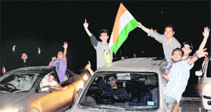 Youths celebrate Indiaa victory in the cricket World Cup. tribune file photos