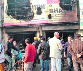 Office of a travel agency gutted at Skylark Chowk in Jalandhar on Friday