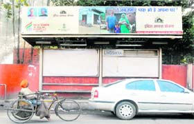 A hoarding of the Congress on Shastri Market Road highlights the achievements of the Central government