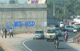 A retaining wall along the Jalandhar-Ludhiana highway defaced by the BSP in violation of the model code of conduct in Jalandhar