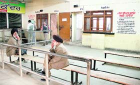 Only two persons seen sitting outside the office of the Tehsildar-1 at the tehsil complex in Jalandhar on Friday