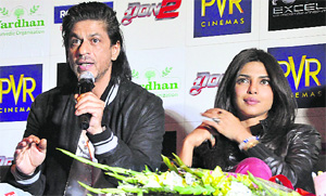 Shah Rukh Khan with Priyanka Chopra during a promotional event for Don 2