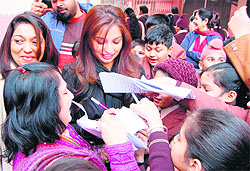 Kanika Dhillon signs autographs during an interaction with children in Amritsar