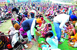 Devotees partake in a langar at the Gurdwara Qila Mubarak Sahib on the occasion of the birth anniversary of Guru Gobind Singh in Bathinda on Saturday