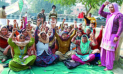 Members of the Mid-day Meal Workers Union Punjab are on chain hunger strike outside the Mini-secretariat in Bathinda since Friday