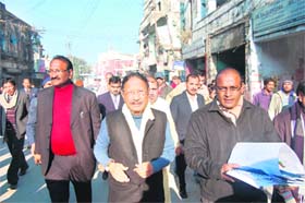 Chief Minister BC Khanduri inspects the demolition drive work on the Chakrata road in Dehradun on Saturday