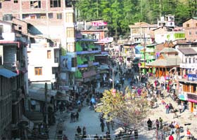 Revellers throng the Manali Mall on the New Years Eve on Saturday