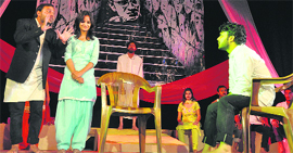 Artistes perform a play during a theatre festival in Jammu on Saturday.
