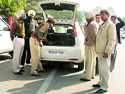 Policemen check a vehicle during a naka in Ludhiana