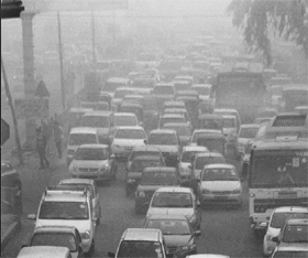 Vehicles stuck in a traffic jam during a foggy morning in Gurgaon on Saturday.