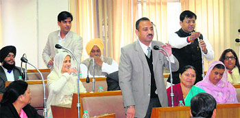 The newly elected councillors of the BJP raise objections before the polling began in Chandigarh on Sunday. 