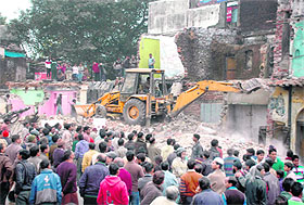 Buildings being razed on the Chakrata road in Dehradun on Sunday.