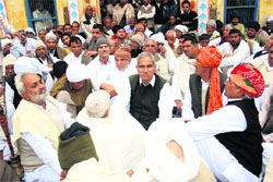 A mahapanchayat in progress at Basana village on Sunday regarding the murder case involving a former INLD MLA from Meham. 