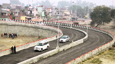 Residents start plying vehicles on a portion of the Domoria railway overbridge before its formal inauguration, which could not take place owing to the impelmentation of the election code of conduct. 