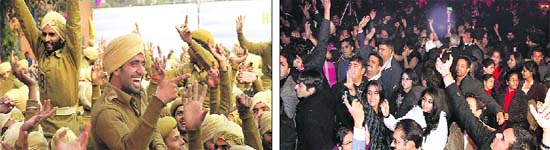 Welcoming 2012: Punjab Police jawans dance to the tunes of Punjabi numbers at a function organised to mark New Year on the PAP campus; and (right) city residents have a gala time at a New Year bash in a hotel in Jalandhar on Sunday