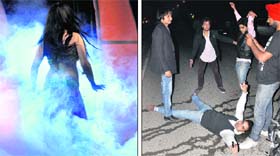 A belly dancer enthrals revellers at a club; and (right) youngsters dance on roads to celebrate New Year in Ludhiana