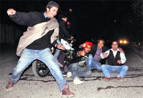 A young man puts his best foot forward on the New Years Eve in Ludhiana