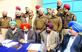 Police officials address a press conference at the Amloh police station on Sunday