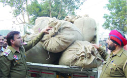 GRP personnel with the contaband seized from the railway station in Amritsar on Monday. 