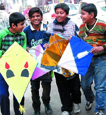 Boys share lighter moments even as they prepare to fly their kites in Bathinda. Kite flying is a popular passion here with people coming out in large numbers to indulge in their pastime on the occasion of Basant in January. 