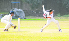 A player in action during a cricket match at Sector 26, Chandigarh, on Monday