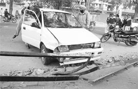 The car that hit a motorcycle on the road separating Phases II and IV in Mohali on Monday. 