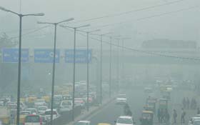 A view of fog-covered Vikas Marg in New Delhi on Monday