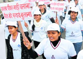 Residents, including schoolchildren, hold an awareness rally on traffic rules during the Road Safety Week organised by the police in Karnal on Monday