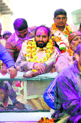 Ishwar Sharma, along with his supporters, after being elected the MC chief.