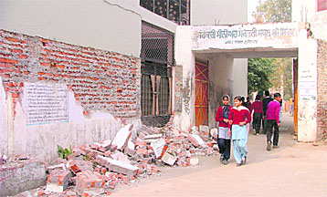 A view of the broken wall in front of Government Senior Secondary School in Gobind Nagar.