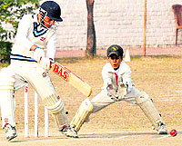 A player plays a shot during a cricket tournament in Sector 48, Chandigarh, on Tuesday