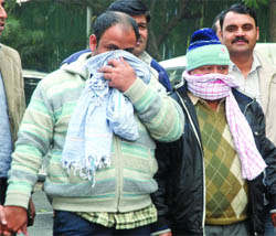 The Delhi police produces two of the five men held for allegedly stealing more than 500 vehicles, at PHQ in New Delhi on Tuesday. 