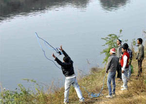 Officials search for a body at Agra Canal at Ajronda Chowk near Mawai village during a special checking in Faridabad. 