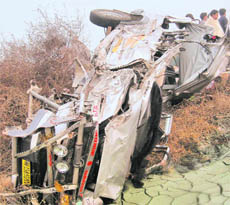 The damaged cruiser Jeep after it collided with a canter between Murlana and Chidana villages on the Panipat-Rohtak national highway on Tuesday.