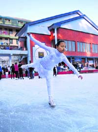 A girl in action during a national championship at the Ice Skating Rink in Shimla on Tuesday