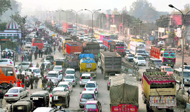 Vehicles stuck in a traffic jam on National Highway-1 during a procession taken out by BJP supporters to welcome Manoranjan Kalia in Jalandhar on Tuesday. 