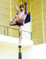 A student participates in the All-India Inter-University Artistic Gymnastics, Rhythmic Gymnastics and Malkhamb Championship at GND University in Amritsar on Tuesday.