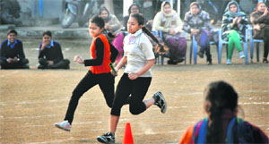 Girls participate in a relay race during an athletics meet at BVM School in Ludhiana.
