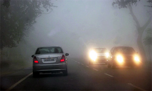 Motorcars find it difficult to move in dense fog on Mohali-Fategarh Sahib road on Tuesday.