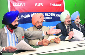 Members of the All India Defence Brotherhood and the Indian Ex-servicemen's Movement address a press conference in Chandigarh on Tuesday.