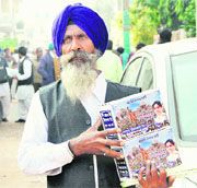 A BSP worker with the party's publicity material in Jalandhar on Tuesday. 