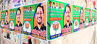 Defying the election code of conduct, political posters still dot the boundary wall of Company Bagh in Amritsar. 