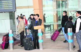 Some passengers whose flights have been cancelled due to fog wait at the airport in Chandigarh on Wednesday