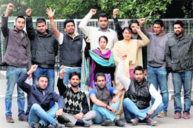 Members of the Panjab University Campus Students Council protest against hike of mess charges on the university campus in Chandigarh on Wednesday