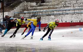 Ice skaters take part in a race on the final day of the national championship in Shimla on Wednesday