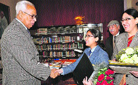 Governor NN Vohra shakes hand with Shreya Bharti, students of Heritage School in Jammu on Wednesday. 