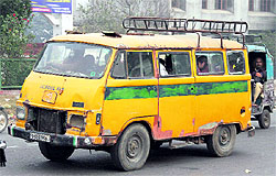 A worn out school bus ferries schoolchildren in Jalandhar on Wednesday